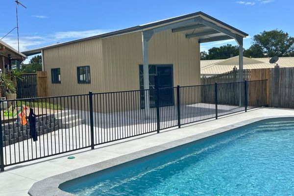 Shed with awning near pool