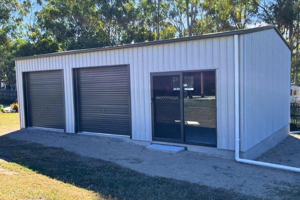 Triple garage with 2 roller doors and one sliding door